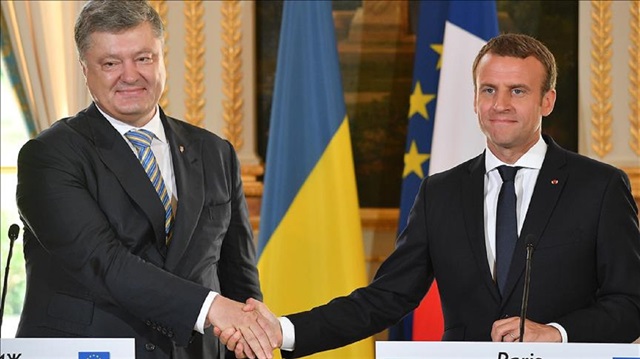 French President Emmanuel Macron (R) shakes hands with Ukrainian President Petro Poroshenko (L) during their joint press conference at the Elysee Palace in Paris, France on June 26, 2017.