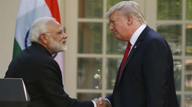 U.S. President Donald Trump (R) greets Indian Prime Minister Narendra Modi during their joint news conference in the Rose Garden of the White House in Washington, U.S., June 26, 2017.