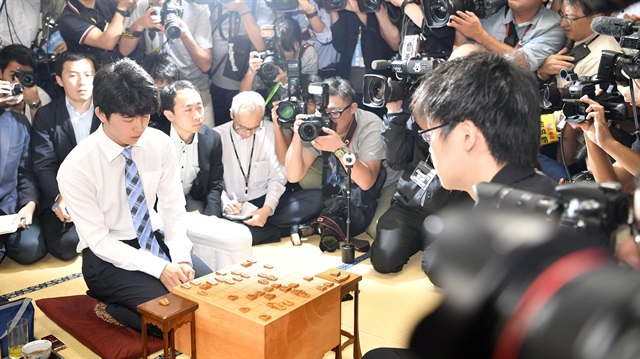 Japan's youngest professional shogi player Sota Fujii is pictured after defeating fellow player Yasuhiro Masuda n the prestigious Ryuo Championship finals in Tokyo.