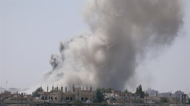Smoke rises from the al-Mishlab district at Raqqa's southeastern outskirts, Syria 