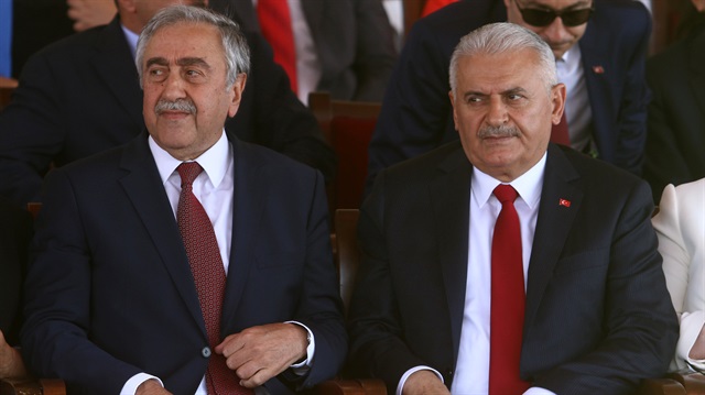 Turkish Cypriot leader Mustafa Akıncı (L) and Turkish Prime Minister Binali Yıldırım