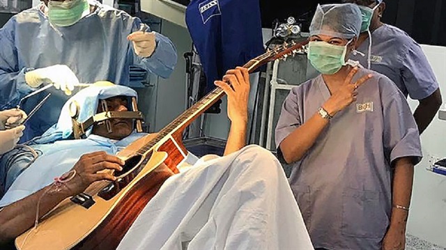 Abhishek Prasad played guitar during a seven-hour surgery. 