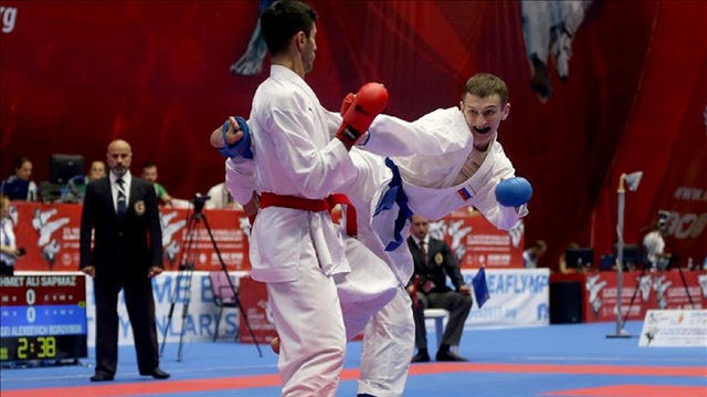 Mehmet Ali Sapmaz (L) of Turkey competes against Alexeevich Borovikin (R) of Russia during the Men's 60kg Kumite final match within the 23rd Summer Deaflympics 2017 at Ataturk Sport Stadium in Samsun, Turkey on July 24, 2017.