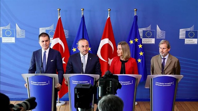 Turkish Minister for EU Affairs Omer Celik (L), Turkish Foreign Minister Mevlut Cavusoglu (2nd L), High Representative of European Union for Foreign Affairs and Security Policy and Vice-President of European Commission Federica Mogherini (2nd R) and European Commissioner for European Neighborhood Policy and Enlargement Negotiations Johannes Hahn (R) hold a joint press conference following EU-Turkey High Level Political Dialogue meeting at European Union (EU) headquarters in Brussels, Belgium on July 25, 2017.