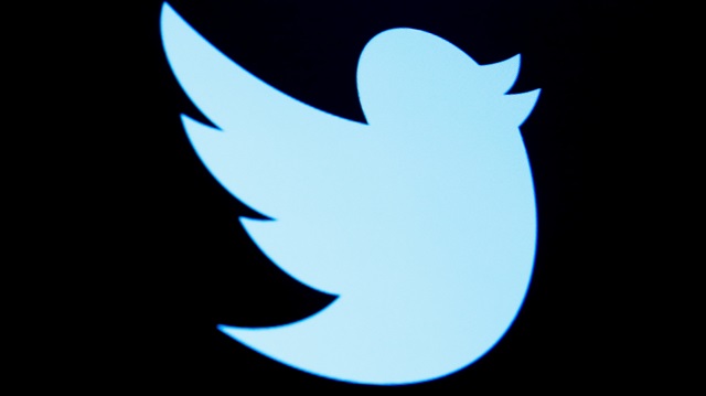 The Twitter logo is displayed on a screen