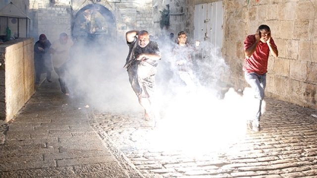 Young Palestinians waiting at the gates of al-Aqsa were attacked by Israeli police.