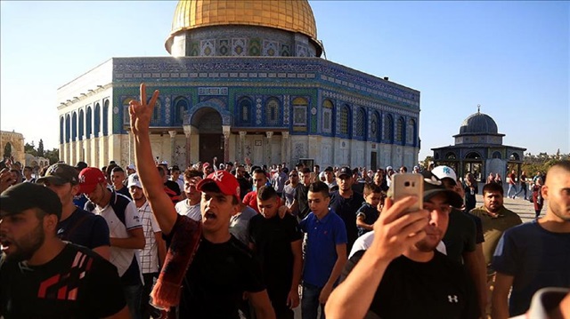 Palestinians gather to celebrate near Jerusalem’s Old City as they enter the Al Aqsa Mosque following the removal of Israel's restrictions at the entrances to Al Aqsa Mosque in Jerusalem on July 28, 2017.