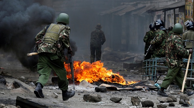 Anti riot policemen clash with protesters supporting opposition leader Raila Odinga in Mathare