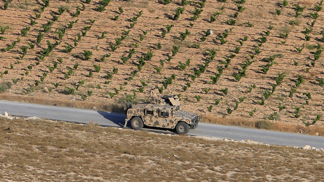 A Lebanese army soldier is seen on a military vehicle 