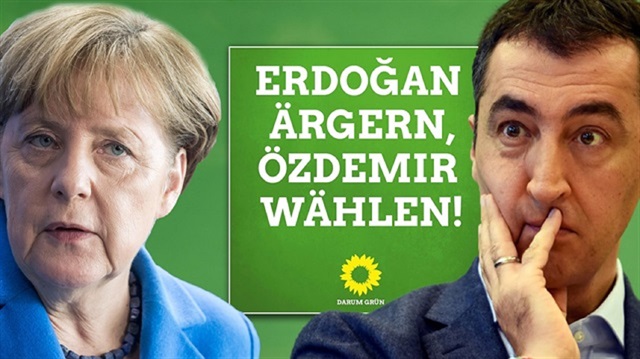 Cem Özdemir, co-chair of the German political party the Greens (R) and German Chancellor Angela Merkel