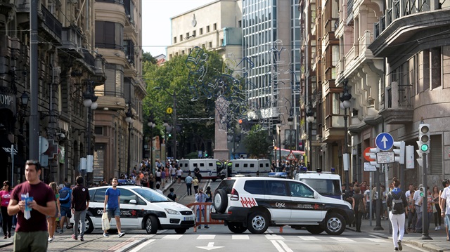 Police vans block the street at the beginning of fiestas of Bilbao