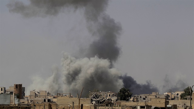 Smoke rises after an air strike during fighting 