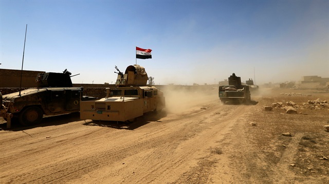 Military vehicles of the Counter Terrorism Service (CTS) are seen during the fight with the Daesh terrorists in Tal Afar, Iraq, August 25, 2017. 