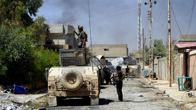 Members of the Counter Terrorism Service (CTS) are seen during the fight with Daesh.