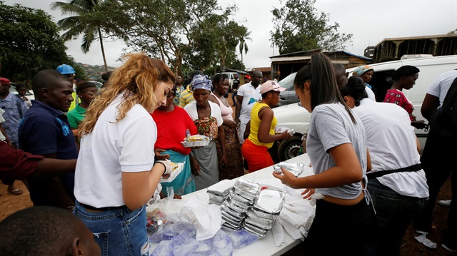 A non-governmental organisation (NGO) is seen distributing meals t