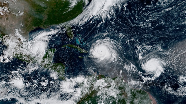 Hurricane Irma, Hurricane Jose (R) and Hurricane Katia (L) are pictured in the Atlantic Ocean in this September 7, 2017 photo.