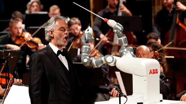 Humanoid robot YuMi conducts the Lucca Philharmonic Orchestra performing a concert 
