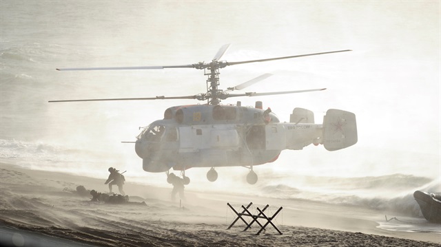 Servicemen take part in the joint war games Zapad