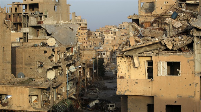 A view shows damaged buildings in Deir al-Zor, eastern Syria February 19, 2014.