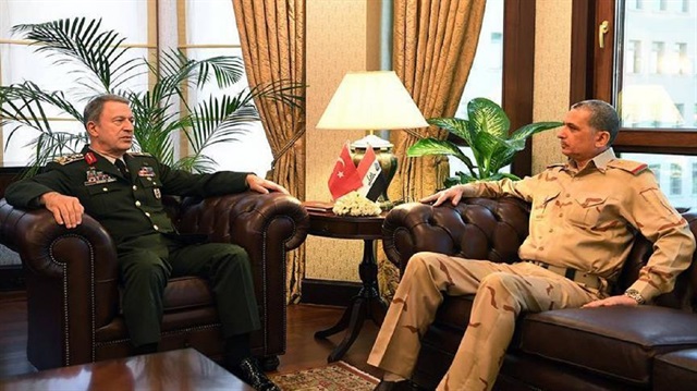 Turkish Chief of General Staff Gen. Hulusi Akar (L) and his Iraqi counterpart Gen. Othman al-Ghanimi 