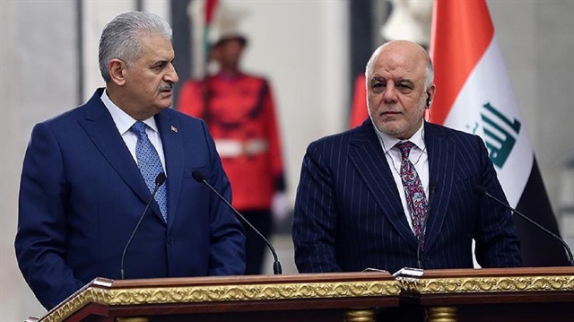 Turkey’s Prime Minister Binali Yıldırım (L) and his Iraqi counterpart Haider al-Abadi