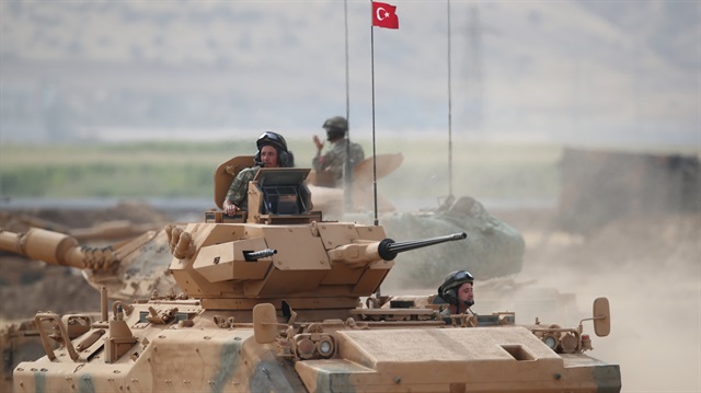 A Turkish tank maneuvers during a military exercise near the Turkish-Iraqi border.