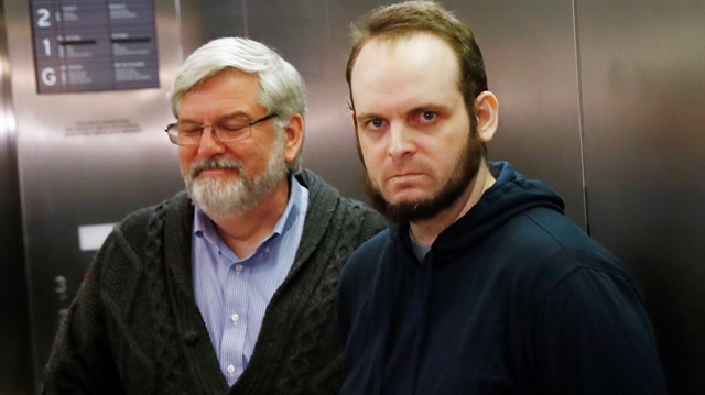 Joshua Boyle stands with his father Patrick Doyle