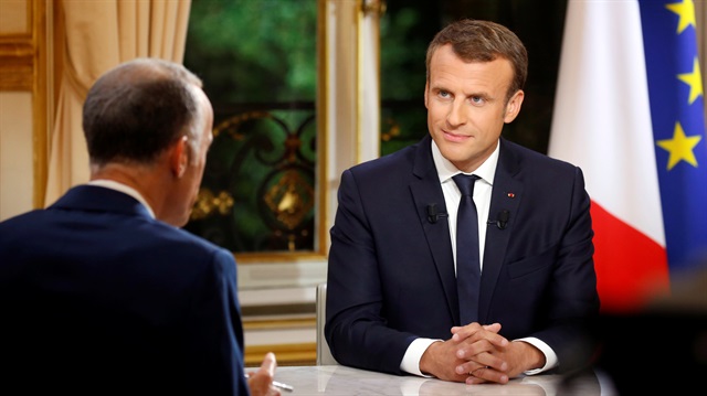 French President Emmanuel Macron is seen during his first long live television interview on prime time at the Elysee Palace in Paris