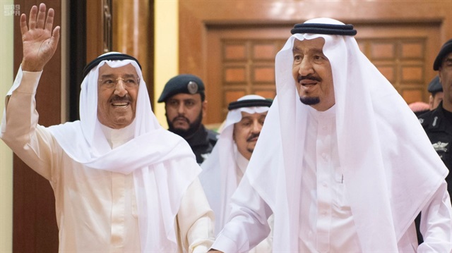 Emir of Kuwait Sabah Al-Ahmad Al-Jaber Al-Sabah waves as he is welcomed by Saudi Arabia's King Salman bin Abdulaziz Al Saud in Riyadh