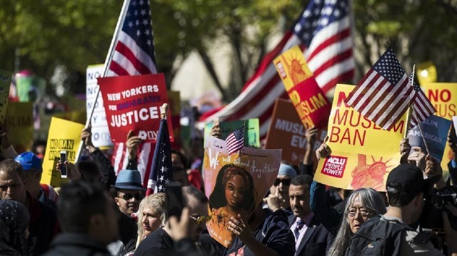 The protest saw U.S. citizens from different backgrounds chant anti-Trump slogans and hold posters reading No Muslim Ban and Stop Profiling Muslims.