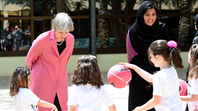 British Prime Minister Theresa May and the Saudi head of the women's section at the general authority for sports, princess Reema Bint Bandar al-Saud, chat with Saudi girls during a basketball class at Olympic headquarters in Riyadh