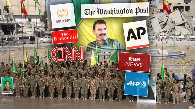 Rakka'da PKK'lı teöristler, elebaşları Öcalan'ın posterini kent merkezine astı. 