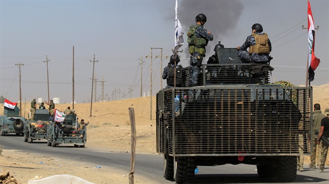 Members of Iraqi federal forces are seen in Dibis area on the outskirts of Kirkuk, Iraq.
