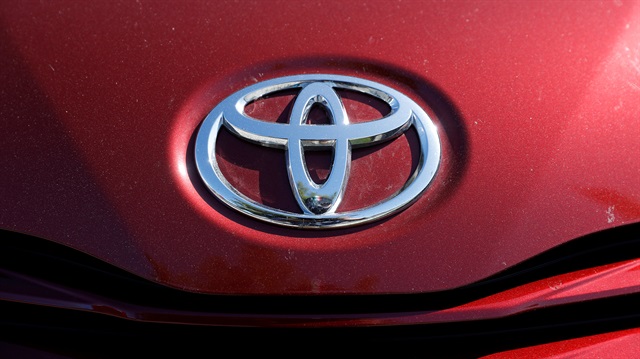 A Toyota logo is seen on a car at City Toyota 