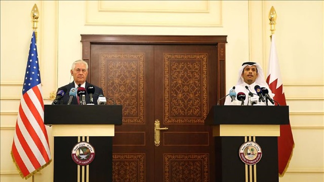 U.S. Secretary of State Rex Tillerson (L) and his Qatari counterpart Mohammed bin Abdulrahman Al Thani (R)