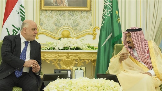 Iraqi Prime Minister Haider al-Abadi (L) and  Saudi King Salman Bin Abdulaziz