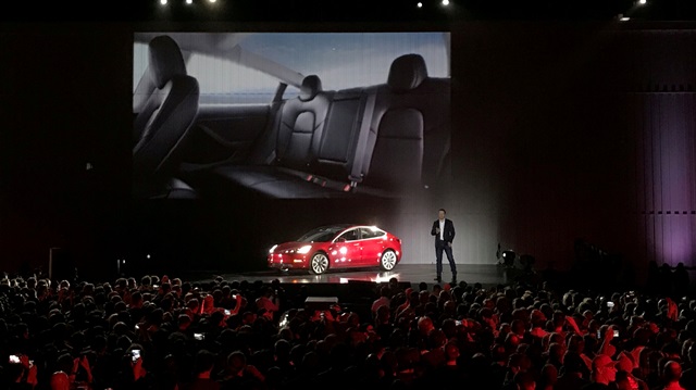 esla Chief Executive Elon Musk introduces one of the first Model 3 cars 