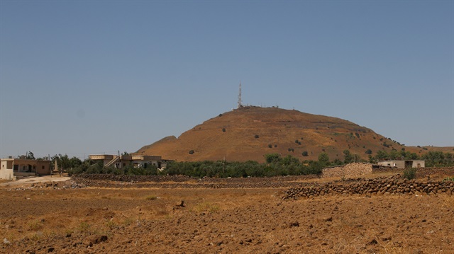 Houses are seen near the border between Syria and the Israeli-occupied Golan Heights in Quneitra, seen from the Syrian side of the border in Quneitra, Syria.