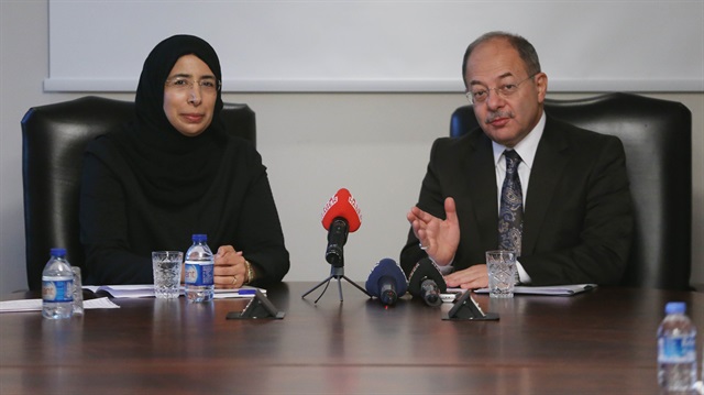 Turkish Deputy Prime Minister Recep Akdağ (R) and Qatari Health Minister Hanan Mohamed al-Kuwari