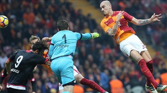 Maicon Roque (R) of Galatasaray and Genclerbirligi's keeper Per Johannes Hopf rise for the ball during a Turkish Super Lig match between Galatasaray and Genclerbirligi at Ali Sami Yen Sports Complex (Turk Telekom Stadium) in Istanbul, Turkey