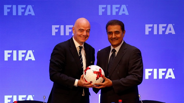 FIFA President Gianni Infantino and AIFF President Praful Patel pose at a news conference after a FIFA Council meeting in Kolkata