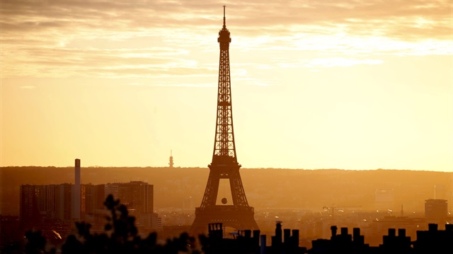 The Eiffel Tower is seen at sunset in Paris, France