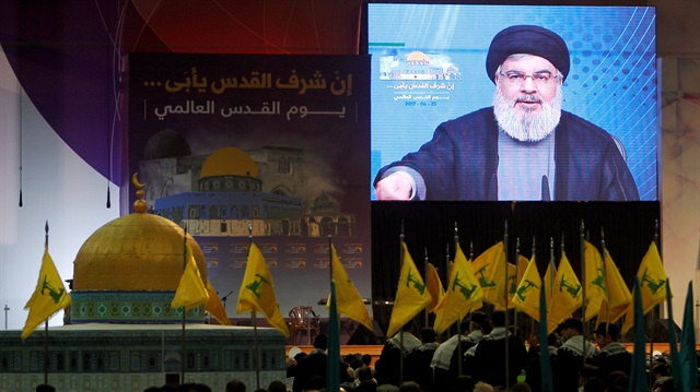 Lebanon's Hezbollah leader Sayyed Hassan Nasrallah addresses his supporters via a screen during a rally marking Al-Quds day in Beirut's southern suburbs, Lebanon June 23, 2017.