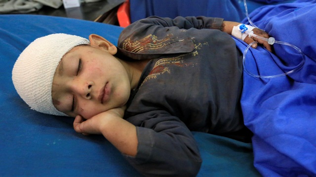 An Afghan boy wounded in an airstrike receives treatment at a hospital in Jalalabad