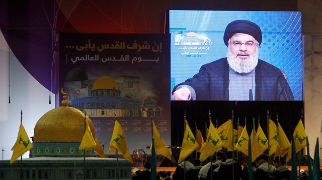 Lebanon's Hezbollah leader Sayyed Hassan Nasrallah addresses his supporters via a screen during a rally marking Al-Quds day in Beirut's southern suburbs, Lebanon.
