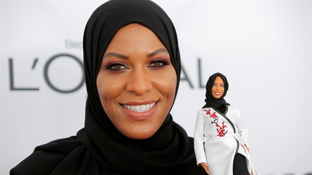 Olympic fencer Ibtihaj Muhammad holds a Barbie doll made in her likeness as she attends the 2017 Glamour Women of the Year Awards at the Kings Theater in Brooklyn, New York.