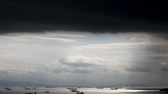 File photo of cargo ships seen sailing under storm clouds in the sea near Greece