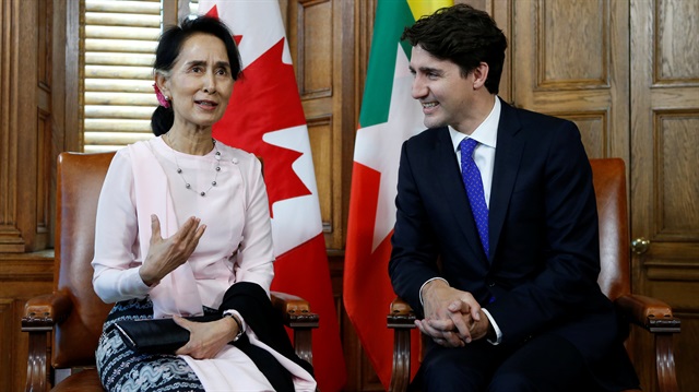 Canada's Prime Minister Justin Trudeau (R) listens to Myanmar State Counsellor Aung San Suu Kyi speak during a meeting in Trudeau's office on Parliament Hill in Ottawa, Ontario, Canada.