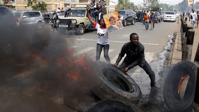 Supporters of Kenyan opposition National Super Alliance (NASA) coalition set tires on fire in Nairobi, Kenya.