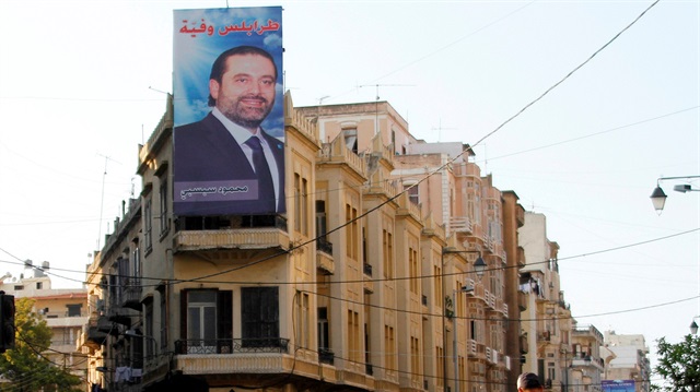 A poster depicting Lebanon's prime minister Saad al-Hariri, who resigned from his post
